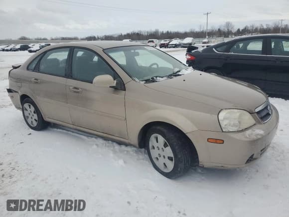 ✅ 2008 Suzuki Forenza • VIN: KL5JD56ZX8K734808 • Lot: 82396564. Listed on Copart with 105,092 mi. Free auction sales archive from the USA and detailed vehicle history report at DreamBid. Image 4.