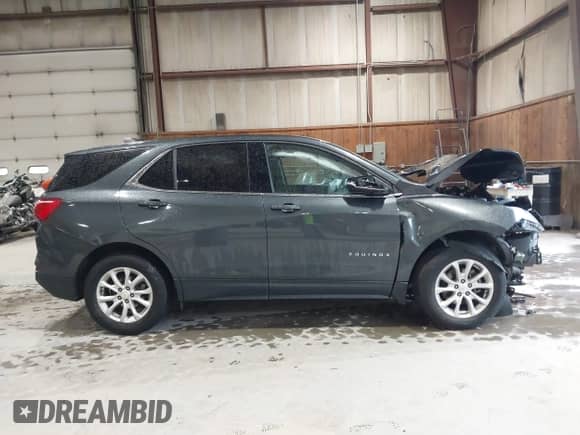 2018 Chevrolet Equinox LT z VIN 2GNAXSEV9J6347911, wystawiony jako IAAI lot #43027750 z przebiegiem 53 687 mil mil oraz . Historia ofert i sprzedaży dostępna na DreamBid. Obrazek 14.