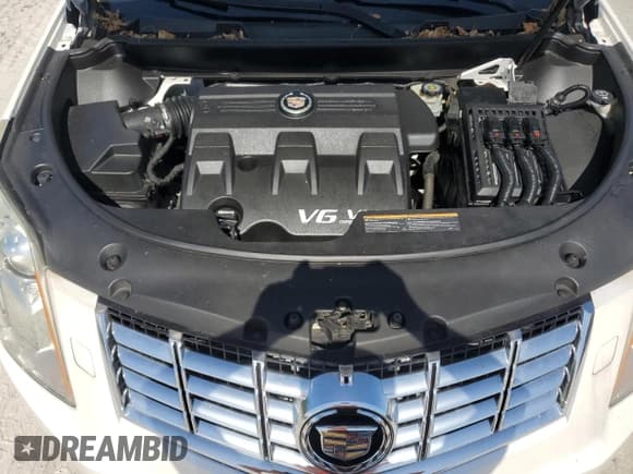 ✅ 2014 Cadillac SRX Performance Collection • VIN: 3GYFNCE30ES643443 • Lot: 78481064. Listed on Copart with 106,657 mi. Free auction sales archive from the USA and detailed vehicle history report at DreamBid. Image 12.