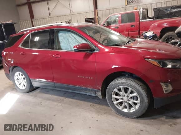 2018 Chevrolet Equinox LT z VIN 2GNAXSEVXJ6112062, wystawiony jako IAAI lot #43406177 z przebiegiem 69 608 mil mil oraz . Historia ofert i sprzedaży dostępna na DreamBid. Obrazek 12.