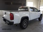 ✅ 2020 Chevrolet Colorado 4WD ZR2 • VIN: 1GCPTEE19L1134962 • Lot: 80129764. Listed on Copart with 143,005 mi. Free auction sales archive from the USA and detailed vehicle history report at DreamBid. Image 3.