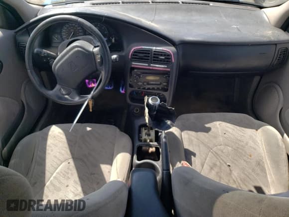 ✅ 2001 Saturn SC • VIN: 1G8ZR12731Z256766 • Лот: 70595904. Опубликован ранее на Copart с пробегом Не указан. Бесплатный доступ к архиву аукционных продаж из США и подробный отчёт об истории автомобиля на DreamBid. Изображение 8.