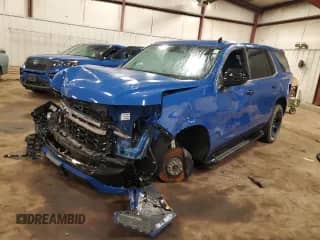 2023 Chevrolet Tahoe Commercial z VIN 1GNSKLED1PR360147, wystawiony jako Copart lot #87086855 z przebiegiem 2 164 mil mil oraz Szkoda całkowita • Salvage title. Historia ofert i sprzedaży dostępna na DreamBid. Obrazek 1.