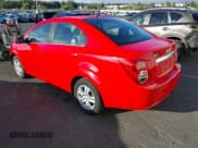 ✅ 2014 Chevrolet Sonic LT • VIN: 1G1JC5SH1E4191254 • Lot: 43253273. Listed on IAAI with 104,251 mi. Free auction sales archive from the USA and detailed vehicle history report at DreamBid. Image 3.