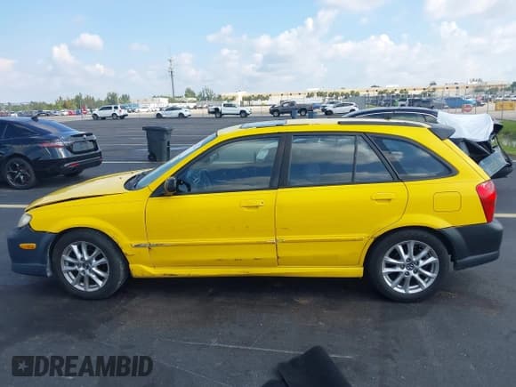✅ 2002 Mazda Protege • VIN: JM1BJ245321542536 • Lot: 43058514. Listed on IAAI with 170,774 mi. Free auction sales archive from the USA and detailed vehicle history report at DreamBid. Image 14.