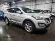 2014 Hyundai Santa Fe z VIN 5XYZW3LA4EG205141, wystawiony jako Copart lot #65400145 z przebiegiem 135 224 mil mil oraz Szkoda całkowita • Salvage title. Historia ofert i sprzedaży dostępna na DreamBid. Obrazek 4.