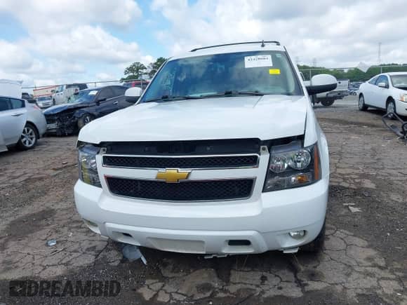 2014 Chevrolet Suburban LT z VIN 1GNSCJE07ER211222, wystawiony jako IAAI lot #42428084 z przebiegiem 214 712 mil mil oraz . Historia ofert i sprzedaży dostępna na DreamBid. Obrazek 12.