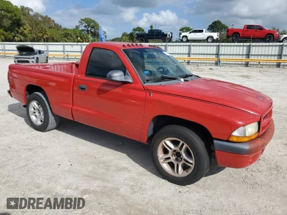 2002 Dodge Dakota Sport z VIN 1B7FL36X72S543943, wystawiony jako Copart lot #80767984 z przebiegiem Nie podano mil oraz Czysty tytuł • Clean title. Historia ofert i sprzedaży dostępna na DreamBid. Obrazek 4.