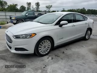 ✅ 2016 Ford Fusion S Hybrid • VIN: 3FA6P0UU5GR350467 • Lot: 67247495. Wystawiony na Copart z przebiegiem 133 764 mil. Bezpłatny archiwum sprzedaży aukcyjnych z USA i szczegółowy raport historii pojazdu na DreamBid. Zdjęcie 1.