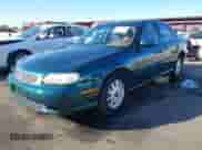 1999 Chevrolet Malibu z VIN 1G1ND52M1XY131000, wystawiony jako IAAI lot #41382252 z przebiegiem 129 845 mil mil oraz . Historia ofert i sprzedaży dostępna na DreamBid. Obrazek 2.