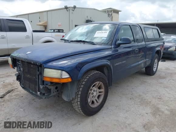 2002 Dodge Dakota Sport z VIN 1B7GL32X52S525368, wystawiony jako IAAI lot #42420709 z przebiegiem 241 497 mil mil oraz . Historia ofert i sprzedaży dostępna na DreamBid. Obrazek 2.