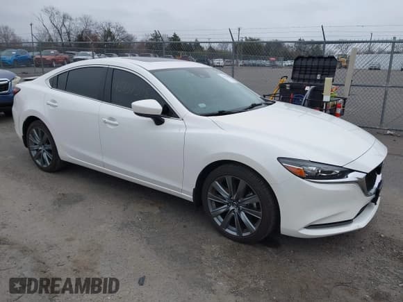 ✅ 2021 Mazda 6 Grand Touring • VIN: JM1GL1TY1M1616447 • Lot: 43737508. Listed on IAAI with 31,293 mi. Free auction sales archive from the USA and detailed vehicle history report at DreamBid. Image 1.