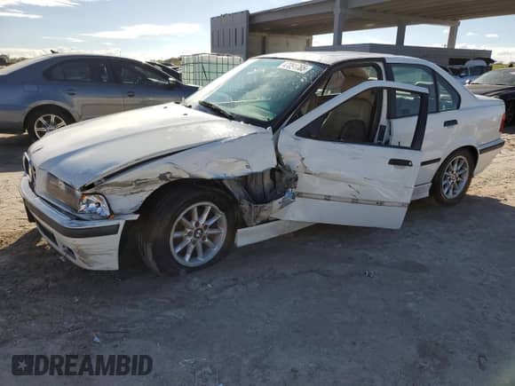 1998 BMW 3 Series 328i with VIN WBACD4322WAV64531, listed as a Copart auction lot 47091785 with 394,082 mi miles and Salvage title. Bid and sale history available at DreamBid. Image 1.