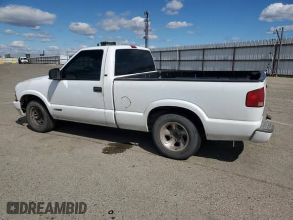 1999 Chevrolet S-10 LS with VIN 1GCCS1444XK140612, listed as a Copart auction lot 82521425 with 248,388 mi miles and Salvage title. Bid and sale history available at DreamBid. Image 2.