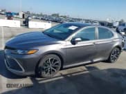 ✅ 2021 Toyota Camry Hybrid LE • VIN: 4T1C31AK8MU548512 • Lot: 43508019. Listed on IAAI with 56,771 mi. Free auction sales archive from the USA and detailed vehicle history report at DreamBid. Image 14.