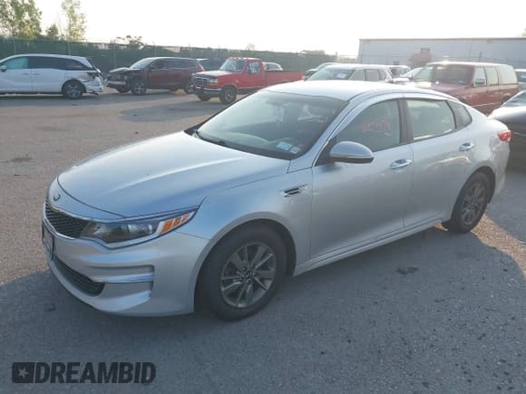 ✅ 2016 Kia Optima LX Turbo • VIN: 5XXGT4L12GG001001 • Lot: 42953378. Listed on IAAI with 187,065 mi. Free auction sales archive from the USA and detailed vehicle history report at DreamBid. Image 2.