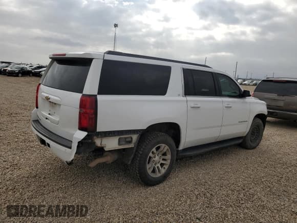 ✅ 2020 Chevrolet Suburban LT • VIN: 1GNSCHKC5LR119885 • Lot: 82712425. Listed on Copart with 220,324 mi. Free auction sales archive from the USA and detailed vehicle history report at DreamBid. Image 3.