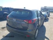 ✅ 2014 Mazda CX-5 Sport • VIN: JM3KE2BE6E0376246 • Lot: 43627211. Listed on IAAI with 129,654 mi. Free auction sales archive from the USA and detailed vehicle history report at DreamBid. Image 4.