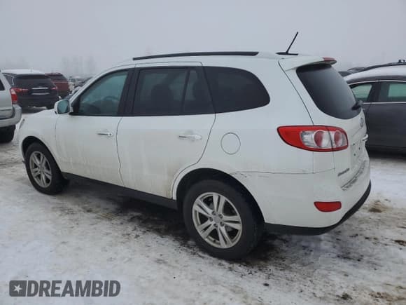 ✅ 2012 Hyundai Santa Fe SE • VIN: 5XYZHDAG0CG119362 • Lot: 82902764. Listed on Copart with 158,365 mi. Free auction sales archive from the USA and detailed vehicle history report at DreamBid. Image 2.