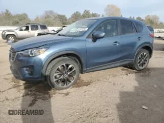 ✅ 2016 Mazda CX-5 Grand Touring • VIN: JM3KE2DY8G0624751 • Lot: 91324495. Wystawiony na Copart z przebiegiem 48 621 mil. Bezpłatny archiwum sprzedaży aukcyjnych z USA i szczegółowy raport historii pojazdu na DreamBid. Zdjęcie 1.