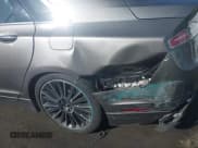 ✅ 2016 Lincoln MKZ Hybrid • VIN: 3LN6L2LU9GR632545 • Lot: 43595387. Wystawiony na IAAI z przebiegiem 56 075 mil. Bezpłatny archiwum sprzedaży aukcyjnych z USA i szczegółowy raport historii pojazdu na DreamBid. Zdjęcie 13.