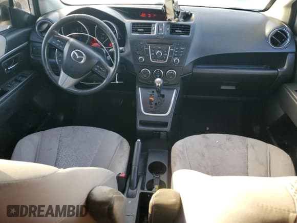 ✅ 2012 Mazda 5 Touring • VIN: JM1CW2CL8C0141965 • Лот: 82707475. Опубликован ранее на Copart с пробегом 148 426 миль. Бесплатный доступ к архиву аукционных продаж из США и подробный отчёт об истории автомобиля на DreamBid. Изображение 8.