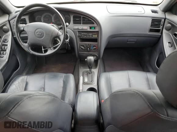 2002 Hyundai Elantra GT z VIN KMHDN55D62U069956, wystawiony jako Copart lot #78931504 z przebiegiem 52 117 mil mil oraz Czysty tytuł • Clean title. Historia ofert i sprzedaży dostępna na DreamBid. Obrazek 8.