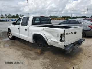 2002 Dodge Dakota Sport с VIN 1B7HL38X12S640531, выставлен на аукционе Copart как лот 81258775 с пробегом 210 552 миль миль и Списание • Salvage title. История ставок и продаж доступна на DreamBid. Изображение 2.
