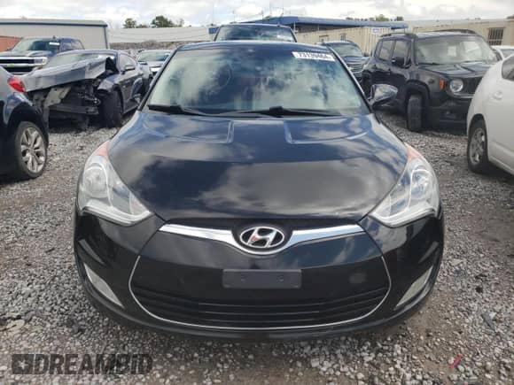 2012 Hyundai Veloster w/Red Int z VIN KMHTC6AD6CU026250, wystawiony jako Copart lot #73139464 z przebiegiem 215 374 mil mil oraz Czysty tytuł • Clean title. Historia ofert i sprzedaży dostępna na DreamBid. Obrazek 5.