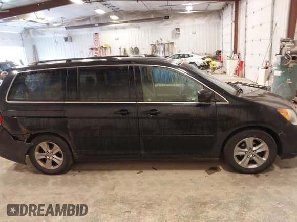 ✅ 2008 Honda Odyssey Touring • VIN: 5FNRL38958B017165 • Lot: 43575767. Listed on IAAI with 209,240 mi. Free auction sales archive from the USA and detailed vehicle history report at DreamBid. Image 13.