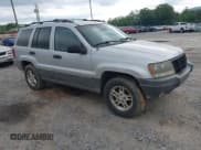 ✅ 2002 Jeep Grand Cherokee Laredo • VIN: 1J4GX48N42C245591 • Lot: 42287218. Listed on IAAI with 166,446 mi. Free auction sales archive from the USA and detailed vehicle history report at DreamBid. Image 1.