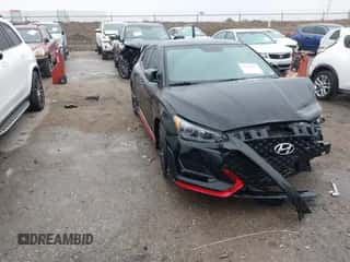 2020 Hyundai Veloster z VIN KMHT36AH5LU007983, wystawiony jako IAAI lot #41516421 z przebiegiem 85 042 mil mil oraz . Historia ofert i sprzedaży dostępna na DreamBid. Obrazek 1.