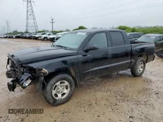 2005 Dodge Dakota ST with VIN 1D7HE28K35S304477, listed as a Copart auction lot 59599385 with 127,683 mi miles and Salvage title. Bid and sale history available at DreamBid. Image 1.