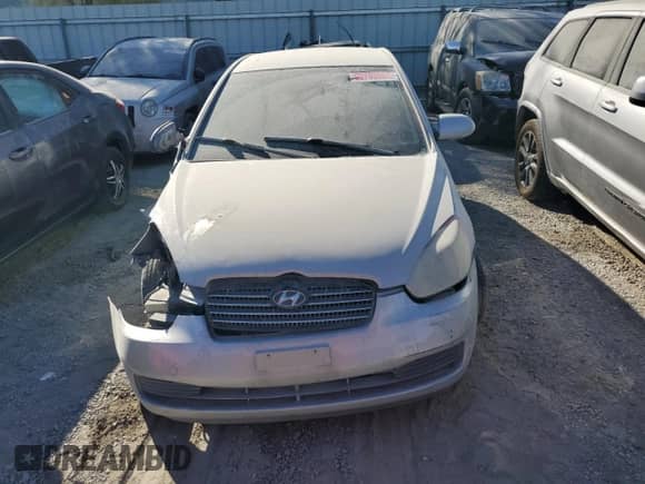 2007 Hyundai Accent GLS z VIN KMHCN46CX7U102105, wystawiony jako Copart lot #65793504 z przebiegiem 213 972 mil mil oraz Szkoda całkowita • Salvage title. Historia ofert i sprzedaży dostępna na DreamBid. Obrazek 5.
