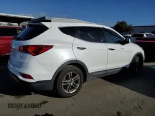 ✅ 2018 Hyundai Santa Fe 2.4L • VIN: 5NMZT3LB3JH070610 • Лот: 40257714. Опубликован ранее на Copart с пробегом 130 044 миль. Бесплатный доступ к архиву аукционных продаж из США и подробный отчёт об истории автомобиля на DreamBid. Изображение 3.