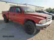 2004 Dodge Dakota SLT z VIN 1D7HG48N04S627240, wystawiony jako Copart lot #75443294 z przebiegiem 151 334 mil mil oraz Szkoda całkowita • Salvage title. Historia ofert i sprzedaży dostępna na DreamBid. Obrazek 4.
