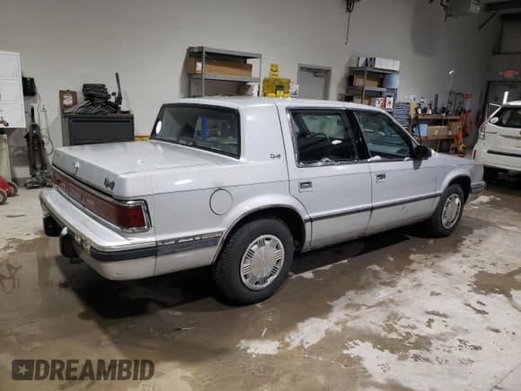 ✅ 1989 Dodge Dynasty • VIN: 1B3BC4634KD442902 • Lot: 85151394. Listed on Copart with 63,120 mi. Free auction sales archive from the USA and detailed vehicle history report at DreamBid. Image 3.