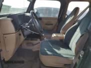 ✅ 2000 Jeep Wrangler Sahara • VIN: 1J4FA59S6YP739265 • Лот: 87437674. Опубликован ранее на Copart с пробегом 208 638 миль. Бесплатный доступ к архиву аукционных продаж из США и подробный отчёт об истории автомобиля на DreamBid. Изображение 7.