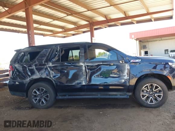 2022 Chevrolet Tahoe Z71 z VIN 1GNSKPKD3NR328938, wystawiony jako IAAI lot #42724313 z przebiegiem 46 394 mil mil oraz . Historia ofert i sprzedaży dostępna na DreamBid. Obrazek 17.