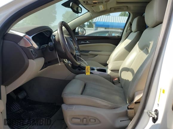 ✅ 2016 Cadillac SRX Premium Collection • VIN: 3GYFNDE32GS548343 • Lot: 63218175. Wystawiony na Copart z przebiegiem 91 265 mil. Bezpłatny archiwum sprzedaży aukcyjnych z USA i szczegółowy raport historii pojazdu na DreamBid. Zdjęcie 7.