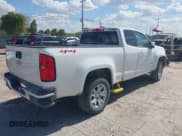 ✅ 2020 Chevrolet Colorado 4WD LT • VIN: 1GCHTCEA6L1163215 • Lot: 43206313. Listed on IAAI with 144,189 mi. Free auction sales archive from the USA and detailed vehicle history report at DreamBid. Image 4.