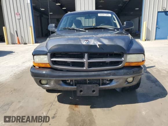 2002 Dodge Dakota Sport z VIN 1B7GL32XX2S588725, wystawiony jako Copart lot #65541345 z przebiegiem 205 568 mil mil oraz Szkoda całkowita • Salvage title. Historia ofert i sprzedaży dostępna na DreamBid. Obrazek 5.