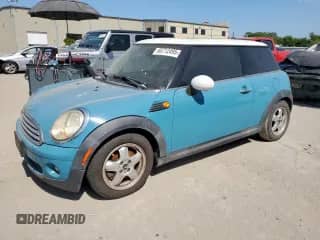 2010 MINI Hardtop with VIN WMWMF3C51ATZ62345, listed as a Copart auction lot 66712495 with 93,202 mi miles and Salvage title. Bid and sale history available at DreamBid. Image 1.