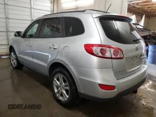 ✅ 2012 Hyundai Santa Fe Limited • VIN: 5XYZKDAG4CG135579 • Lot: 77776364. Listed on Copart with 145,847 mi. Free auction sales archive from the USA and detailed vehicle history report at DreamBid. Image 2.