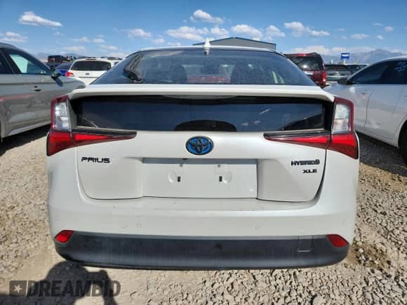 2021 Toyota Prius L Eco с VIN JTDKAMFU5M3127192, выставлен на аукционе Copart как лот 80371565 с пробегом 77 510 миль миль и Списание • Salvage title. История ставок и продаж доступна на DreamBid. Изображение 6.