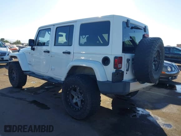 ✅ 2015 Jeep Wrangler Unlimited Sahara • VIN: 1C4BJWEG9FL519182 • Lot: 43672663. Listed on IAAI with 107,421 mi. Free auction sales archive from the USA and detailed vehicle history report at DreamBid. Image 3.
