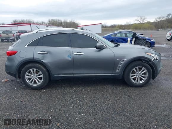 ✅ 2016 Infiniti QX70 • VIN: JN8CS1MW0GM400207 • Lot: 41952548. Listed on IAAI with 146,943 mi. Free auction sales archive from the USA and detailed vehicle history report at DreamBid. Image 13.