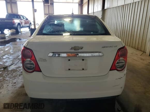 2012 Chevrolet Sonic LT z VIN 1G1JC5SBXC4223224, wystawiony jako Copart lot #53620935 z przebiegiem 146 032 mil mil oraz Szkoda całkowita • Salvage title. Historia ofert i sprzedaży dostępna na DreamBid. Obrazek 6.