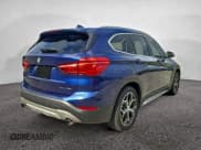 ✅ 2018 BMW X1 xDrive28i • VIN: WBXHT3C31J5L32134 • Лот: 94590915. Опубликован ранее на Copart с пробегом 82 484 миль. Бесплатный доступ к архиву аукционных продаж из США и подробный отчёт об истории автомобиля на DreamBid. Изображение 4.