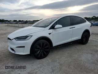 ✅ 2022 Tesla Model X Plaid • VIN: 7SAXCBE63NF357327 • Лот: 91960665. Опубликован ранее на Copart с пробегом 22 518 миль. Бесплатный доступ к архиву аукционных продаж из США и подробный отчёт об истории автомобиля на DreamBid. Изображение 1.